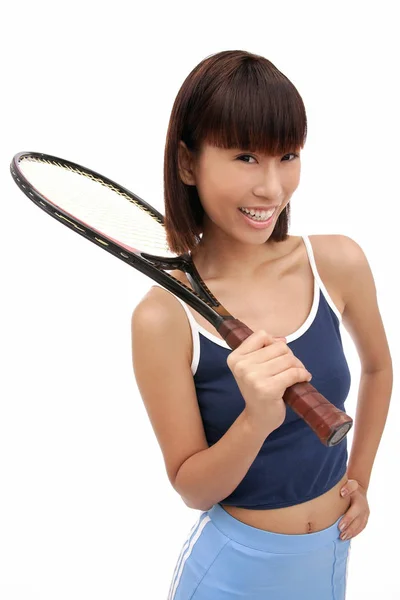 Jonge vrouw met tennisracket — Stockfoto