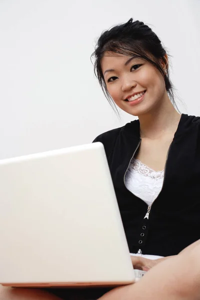 Young woman with laptop Stock Picture