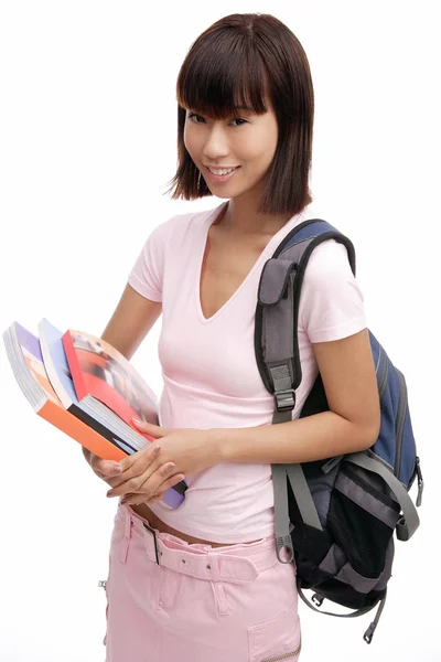 Woman carrying backpack Royalty Free Stock Photos