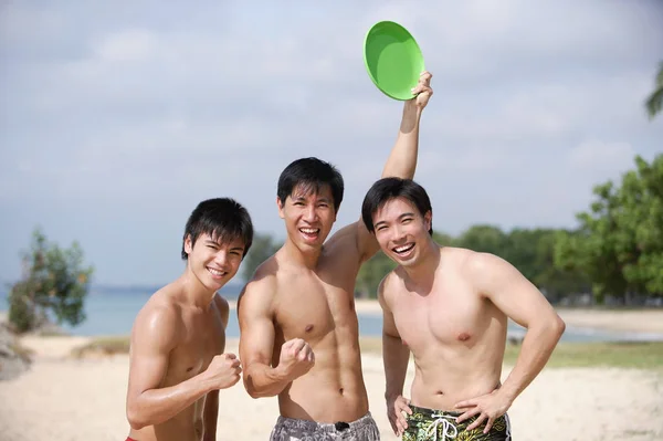 Three men on beach