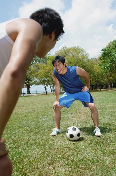 Two men on field — Stock Photo, Image