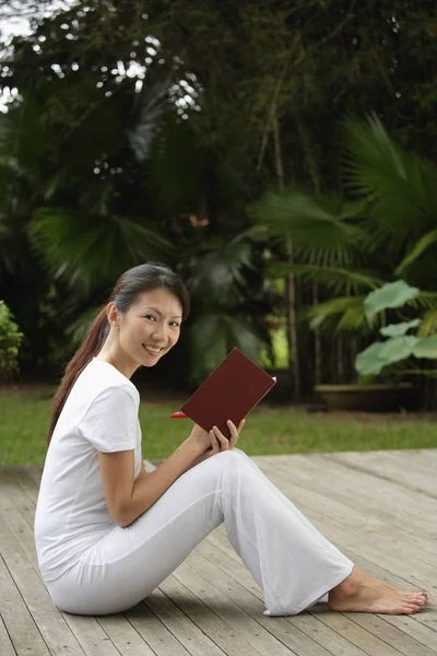 woman sitting on porch