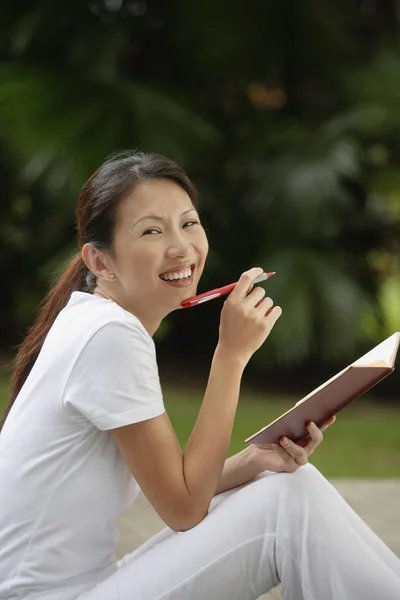 woman sitting on porch