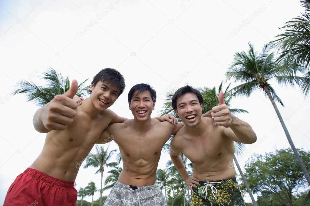 Three men smiling at camera