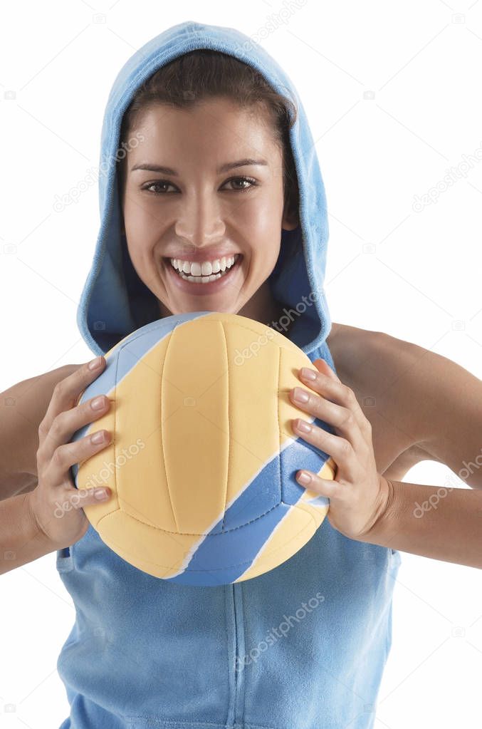 woman holding volleyball 