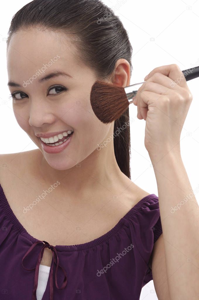 woman applying make-up 