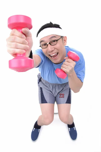Man with pink dumbbells in hands — Stock Photo, Image
