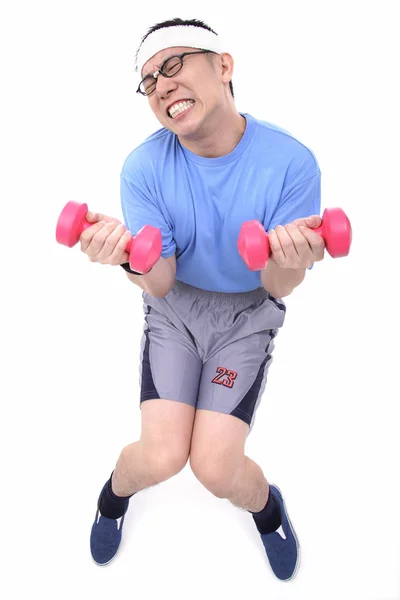 Mann mit rosa Hanteln in der Hand — Stockfoto