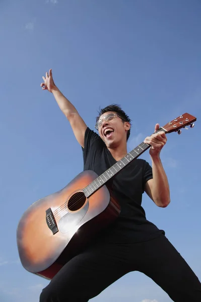 Man holding guitar