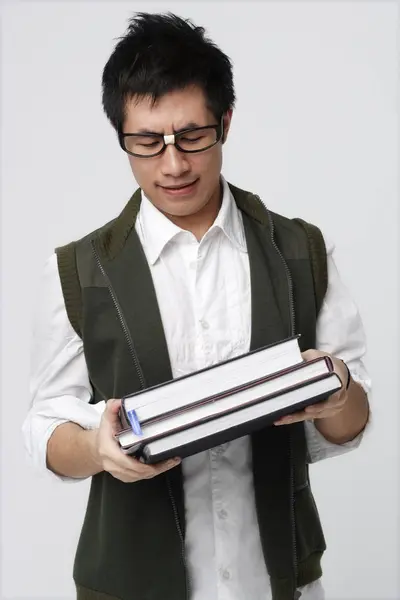 Nerdy homem com livros — Fotografia de Stock