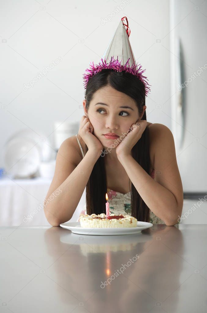 woman with cake smiling