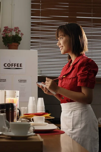 Waitress in diner taking order