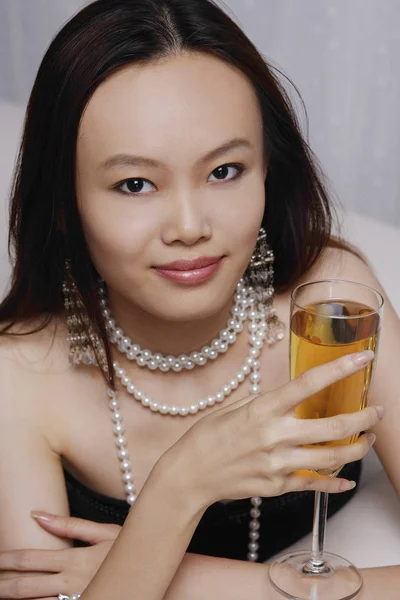 Woman holding glass of champagne — Stock Photo, Image