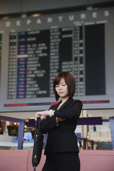 woman waiting at airport