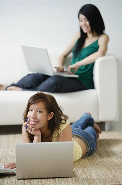 Young Women work with laptop Stock Image