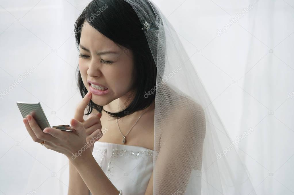 A bride checks her teeth