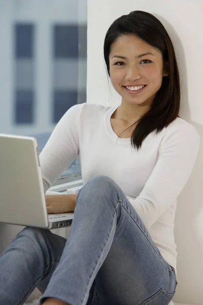 Girl with laptop at home Royalty Free Stock Photos