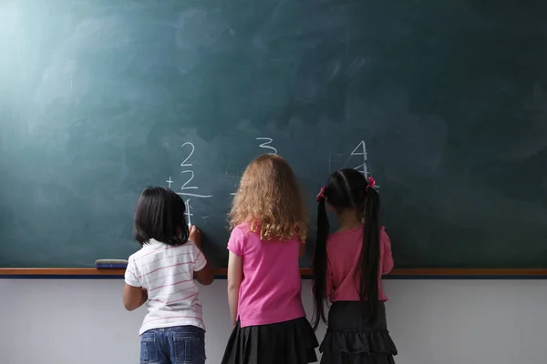 Three young schoolgirls — Stock Photo, Image