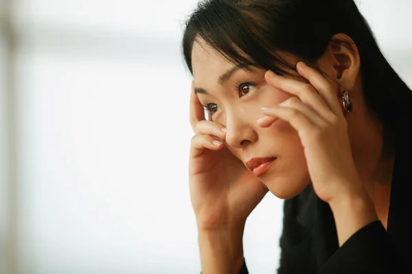 woman, hands on head