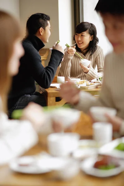 Couples eating at restaurant — Stock Photo, Image