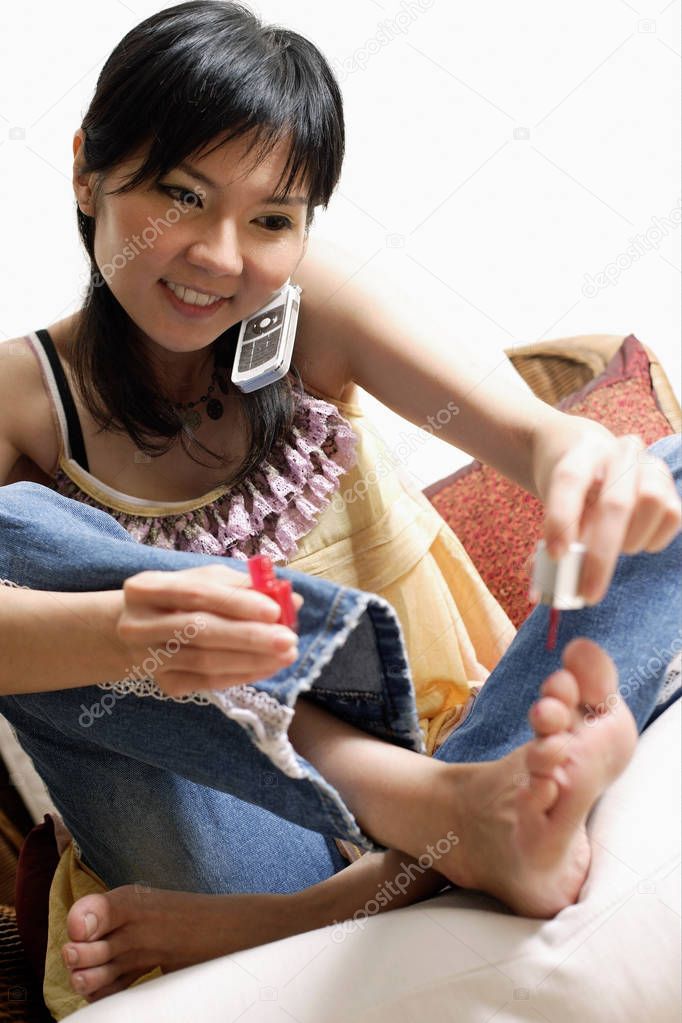 Woman painting her toenails