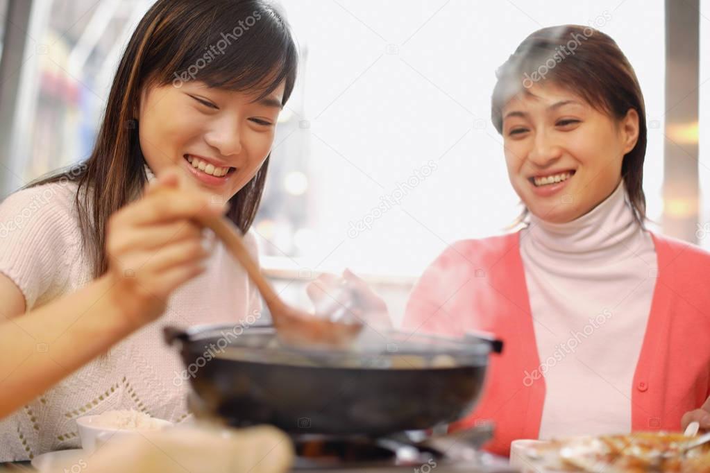 Young women having soup