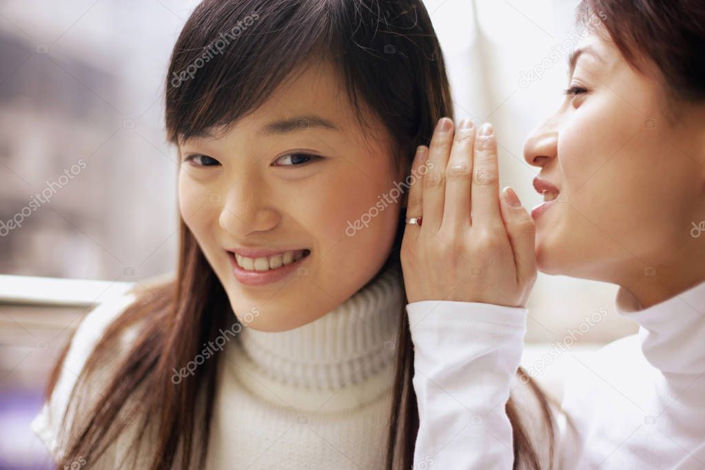 Young woman whispering