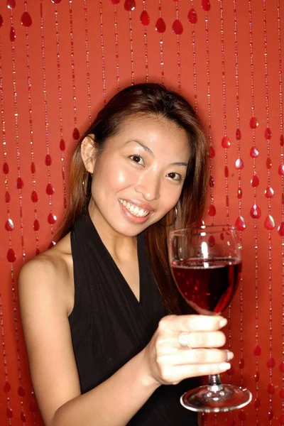 Woman holding wine glass — Stock Photo, Image