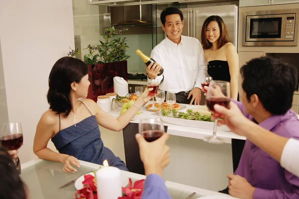 Group of friends having a dinner party at home — Stock Photo, Image