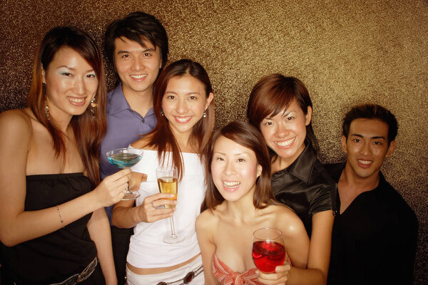 Young adults holding drinks