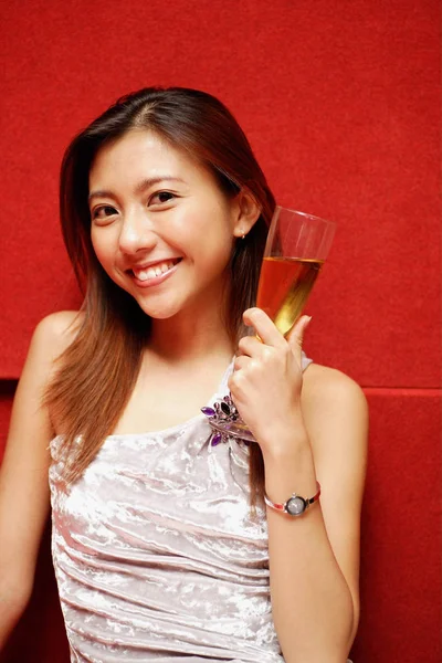 Woman holding champagne — Stock Photo, Image