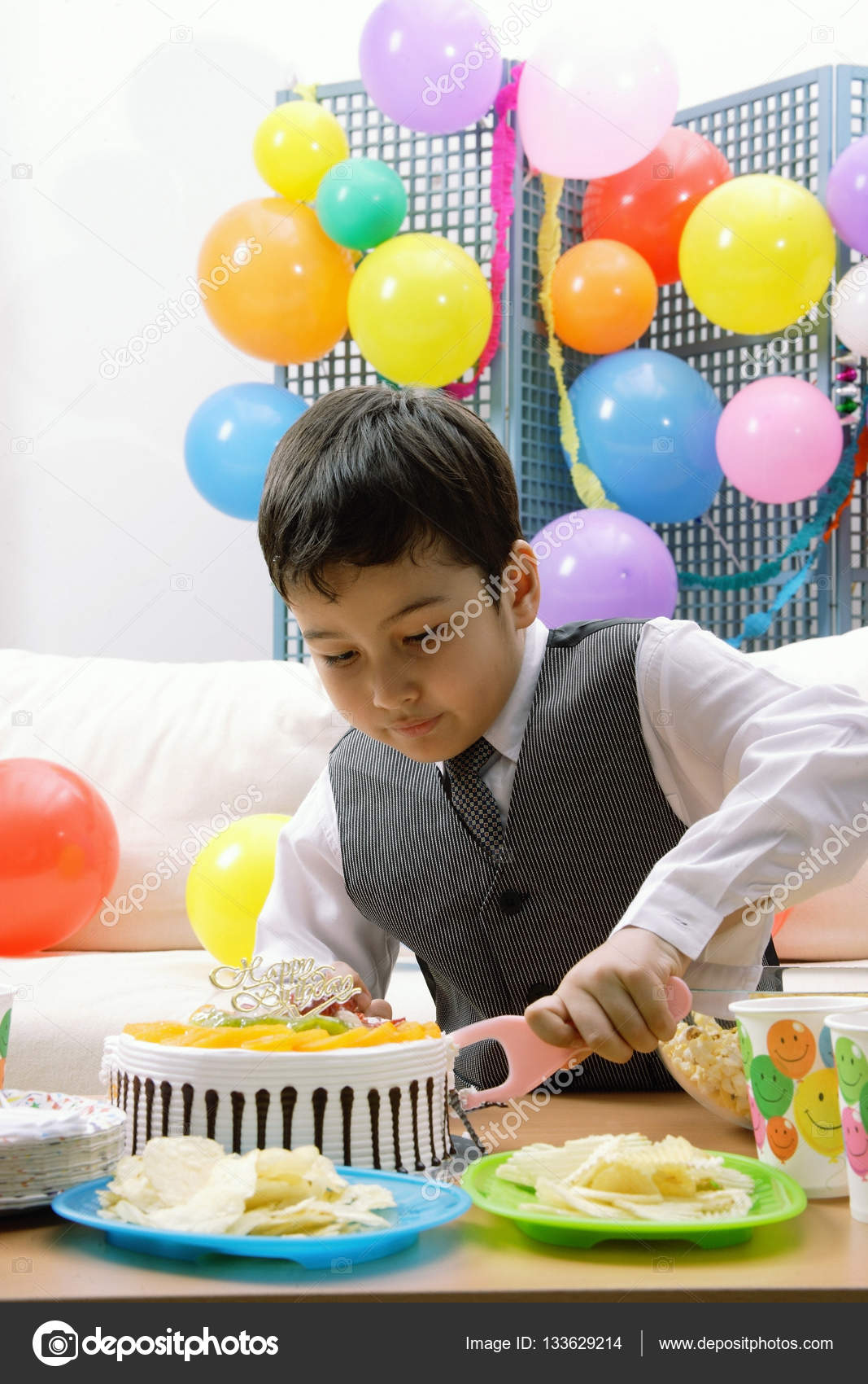Half birthday boy cake Boy cutting birthday cake — Stock Photo