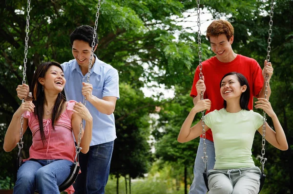 Young couples on park — Stock Photo, Image