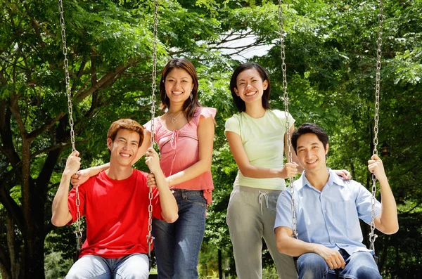 Young couples on park — Stock Photo, Image