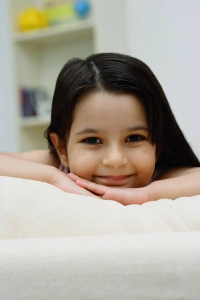 depositphotos 133628456 stock photo girl smiling at camera девушка на кровати с телефоном