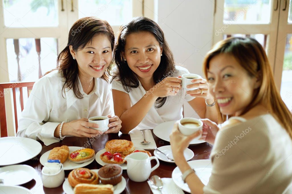 Three women at cafe