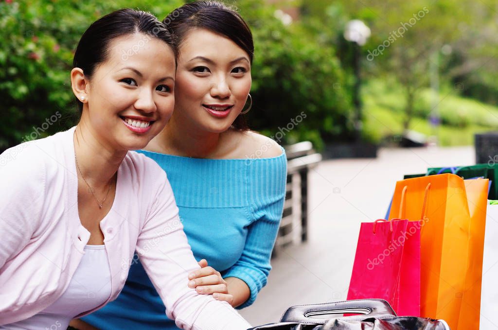 Two women smiling at camera — Stock Photo © MicrostockAsia #133630034