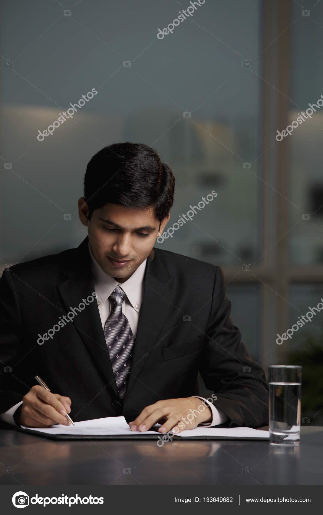 Indian Man At Office Desk Stock Photo C Microstockasia 133649682