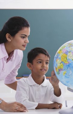 teacher and student look at globe clipart