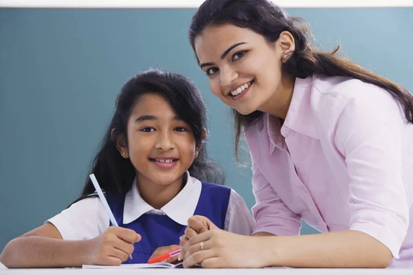 teacher and student smile