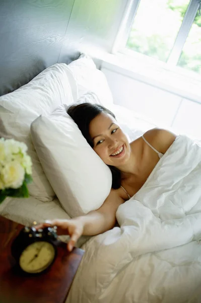 Woman in bed in modern room Royalty Free Stock Images