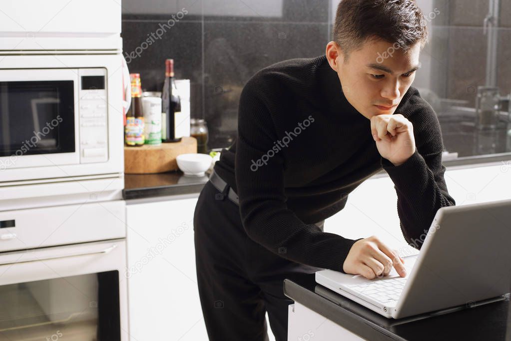 Young businessman in kitchen