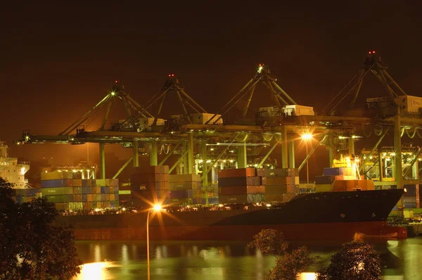 Cargoes and cranes in port — Stock Photo, Image