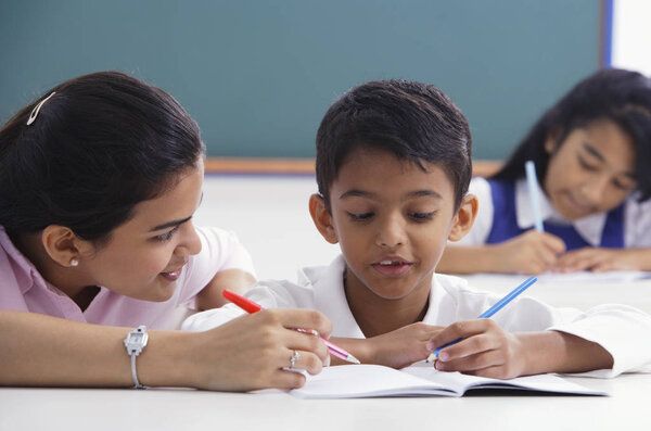 children study with young teacher