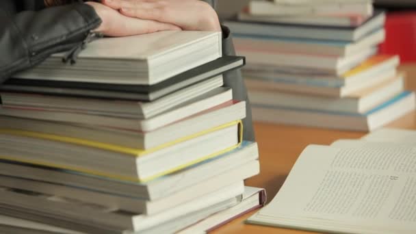 Woman Resting on Stack of Books — Stock Video