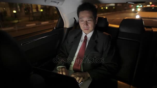 Businessman Riding in Back Seat of Car — Stock Video