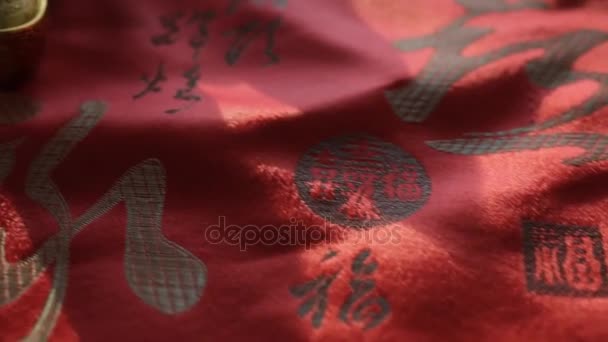 Chinese New Year decorations on embroidered silk — Stock Video