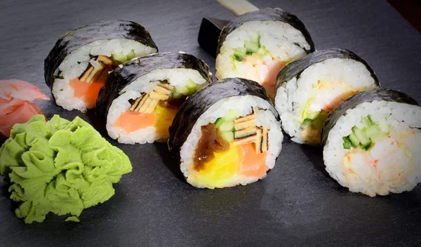 Fresh sushi rolls on slate plate — Stock Photo, Image