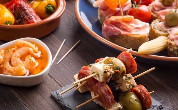 Spanish appetizers on slate — Stock Photo, Image