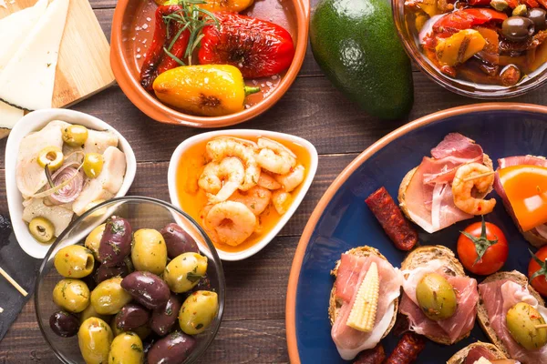 Tapas starters on wooden table — Stock Photo, Image